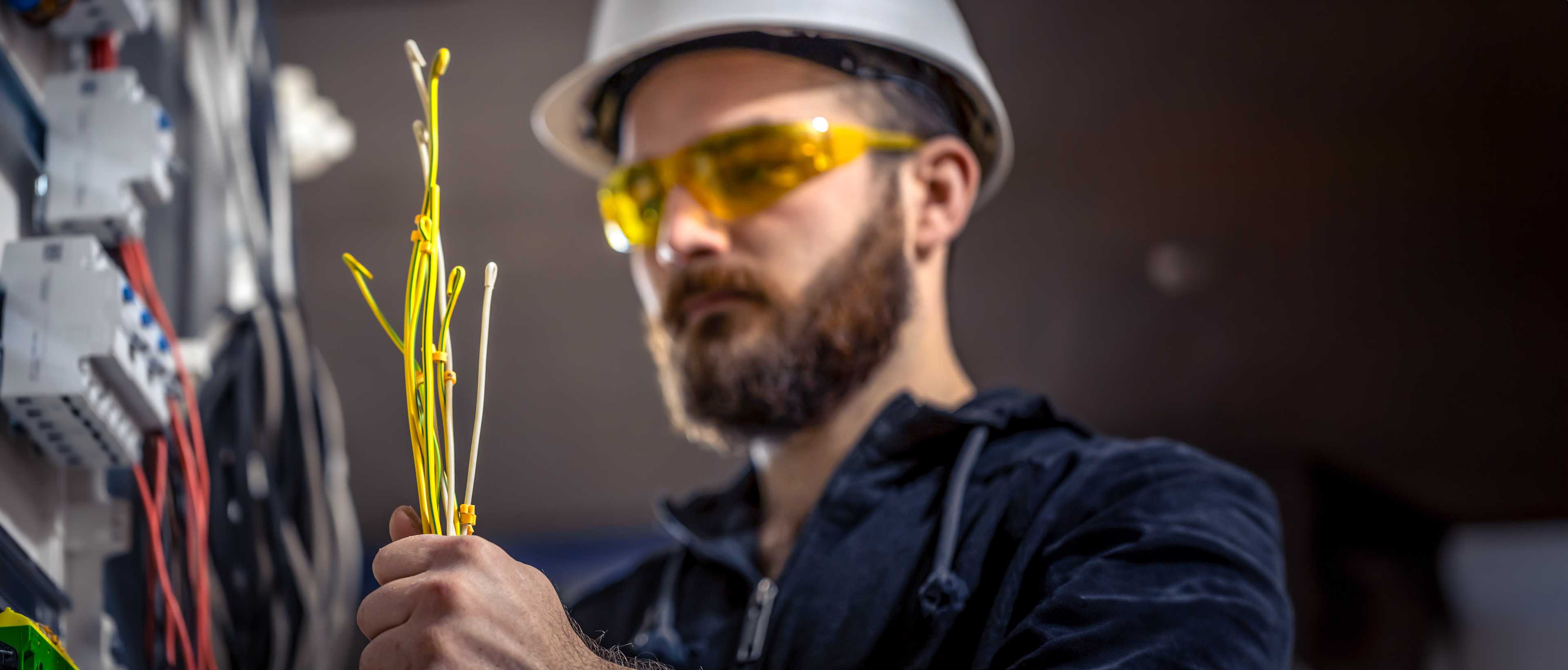 Electrician working on switchboard